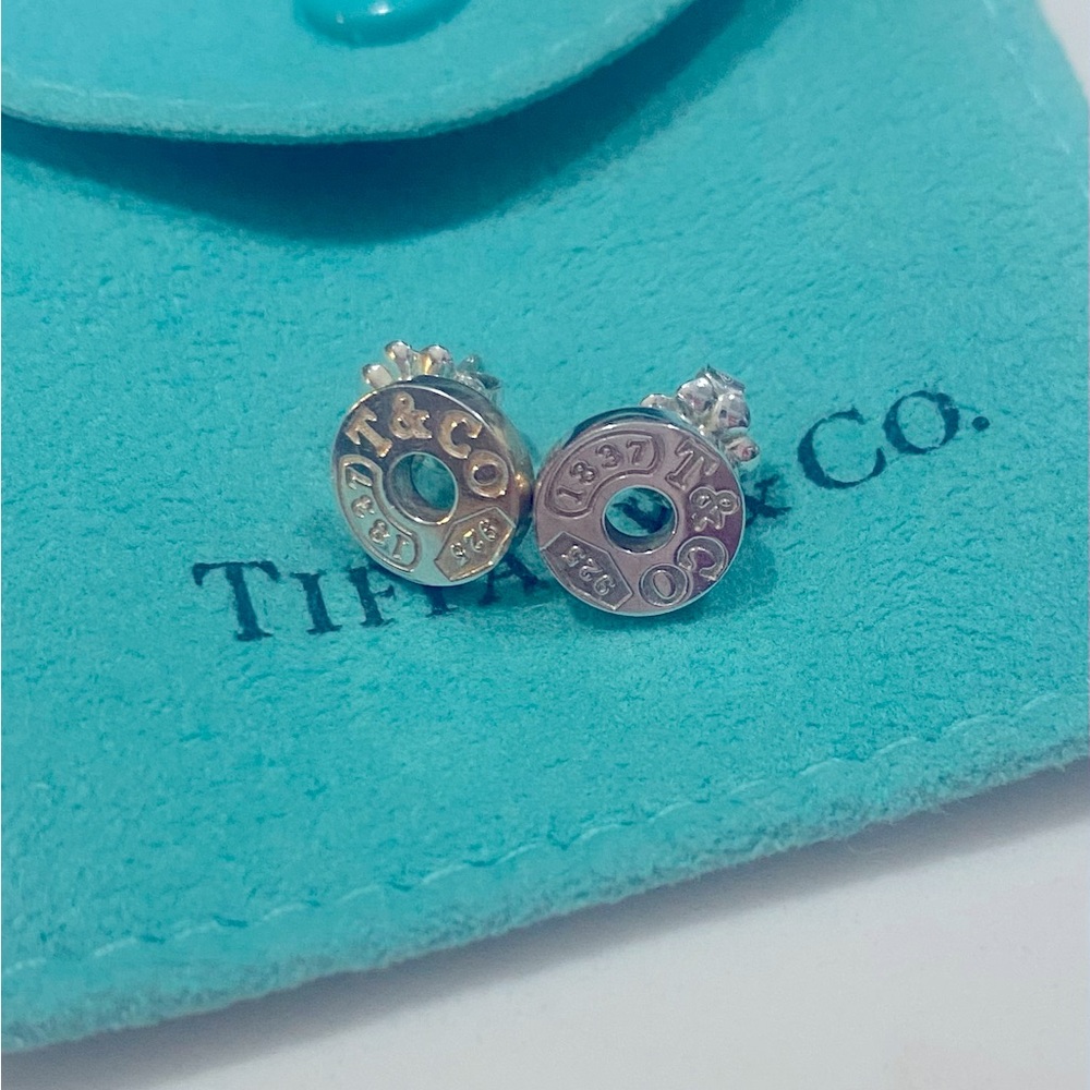 Tiffany & Co. 925 Silver 1837 circle stud earrings with pouch and box.